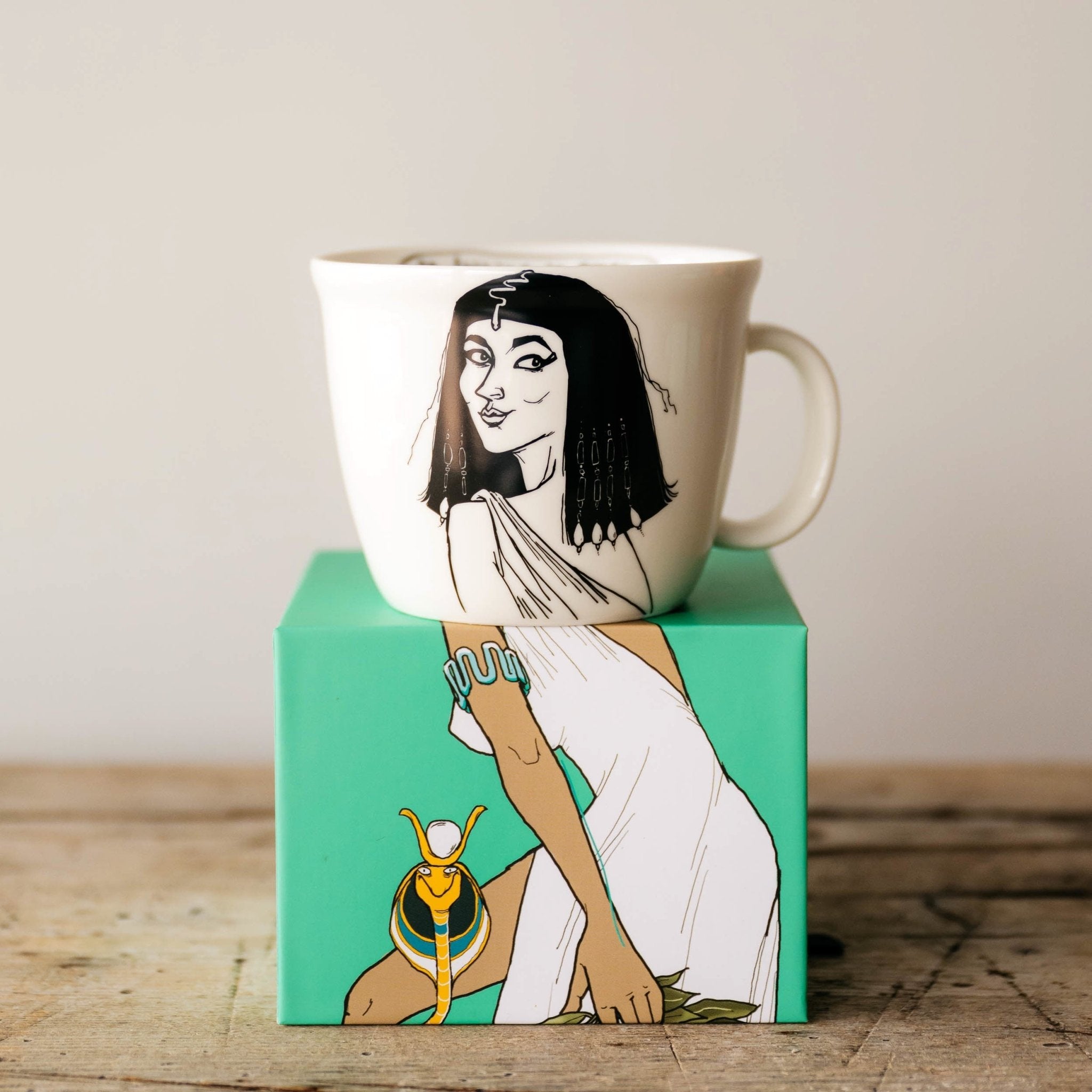 Porcelain cup inspired by Cleopatra on the box