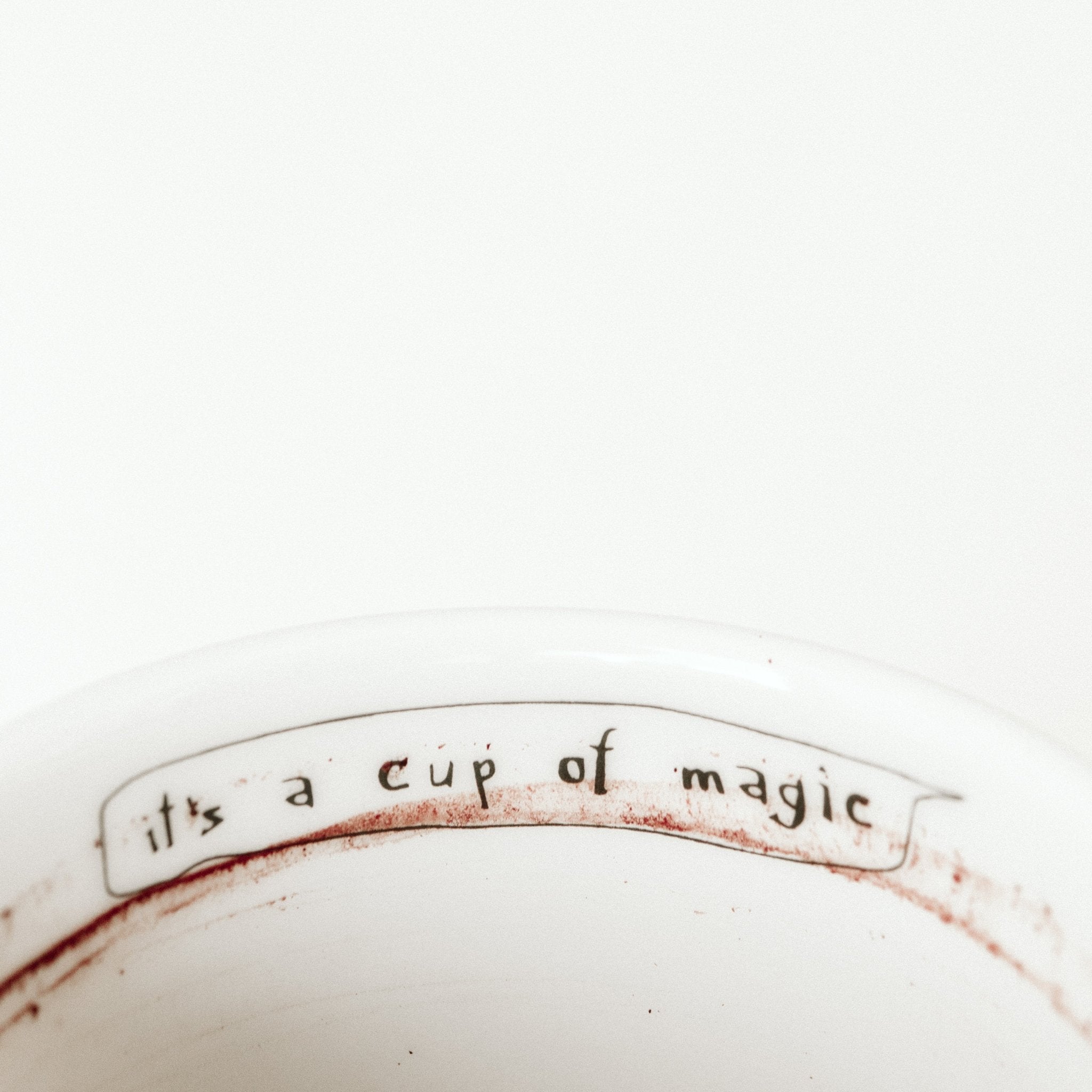 Porcelain cup inspired by Freddie Mercury text inside of the cup