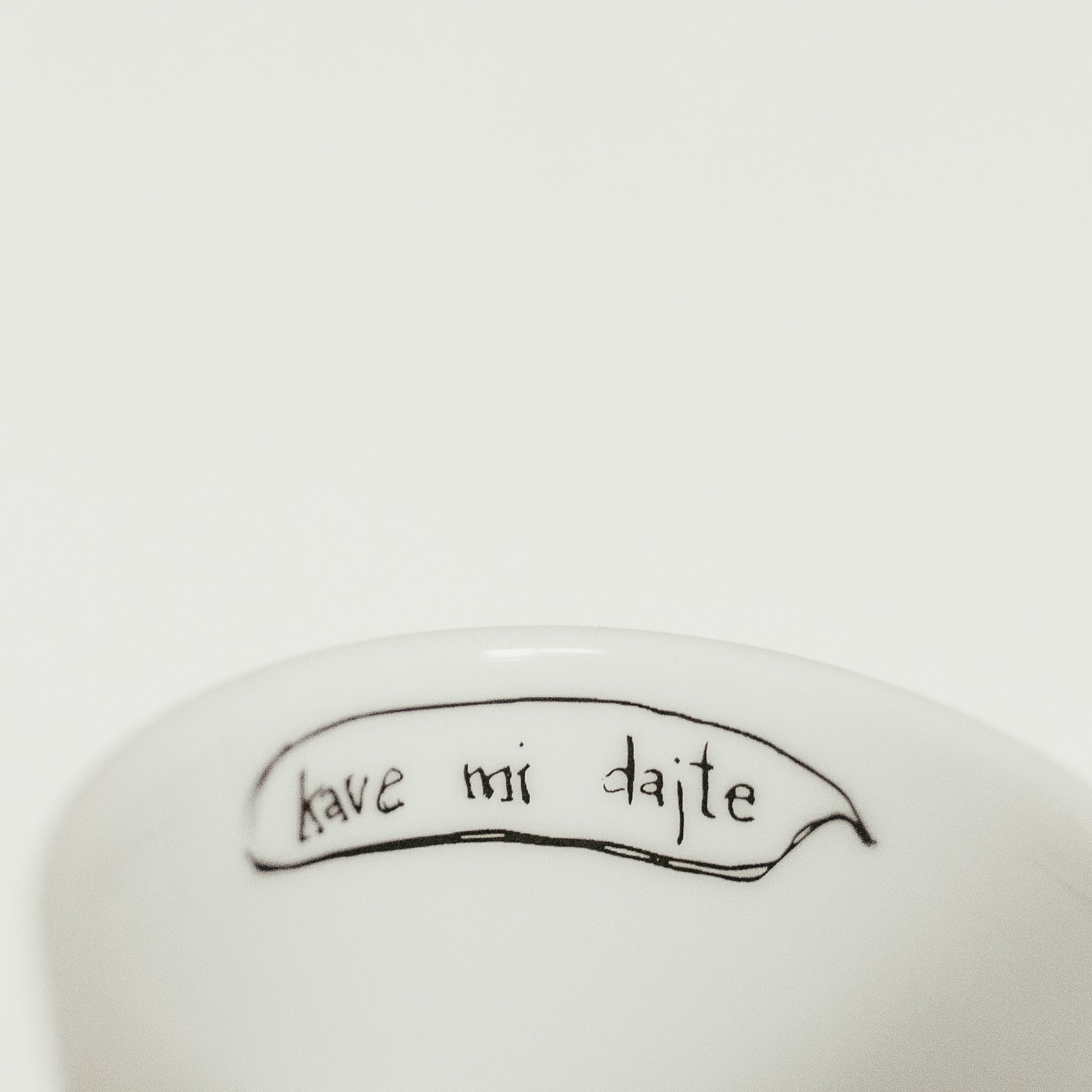 Porcelain cup inspired by Ivan Cankar text inside of the cup