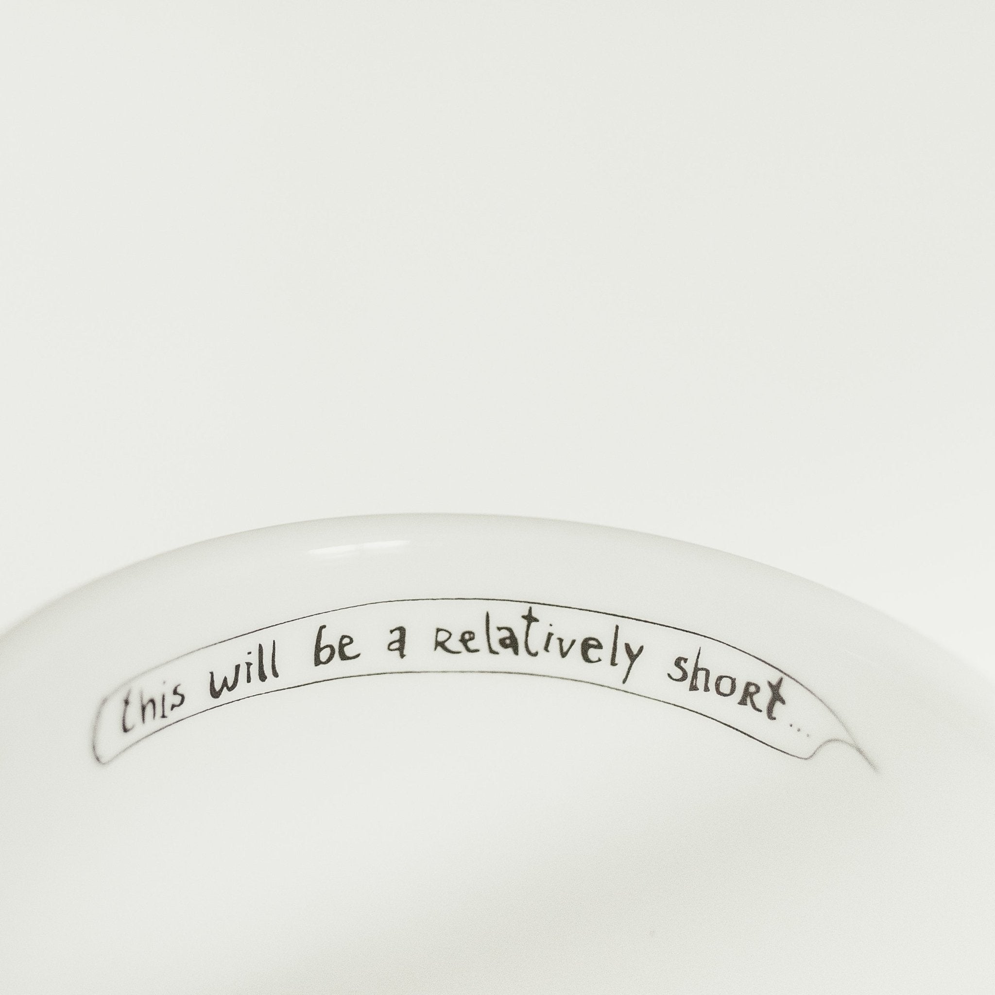 Porcelain cup inspired by Albert Einstein text inside of the cup