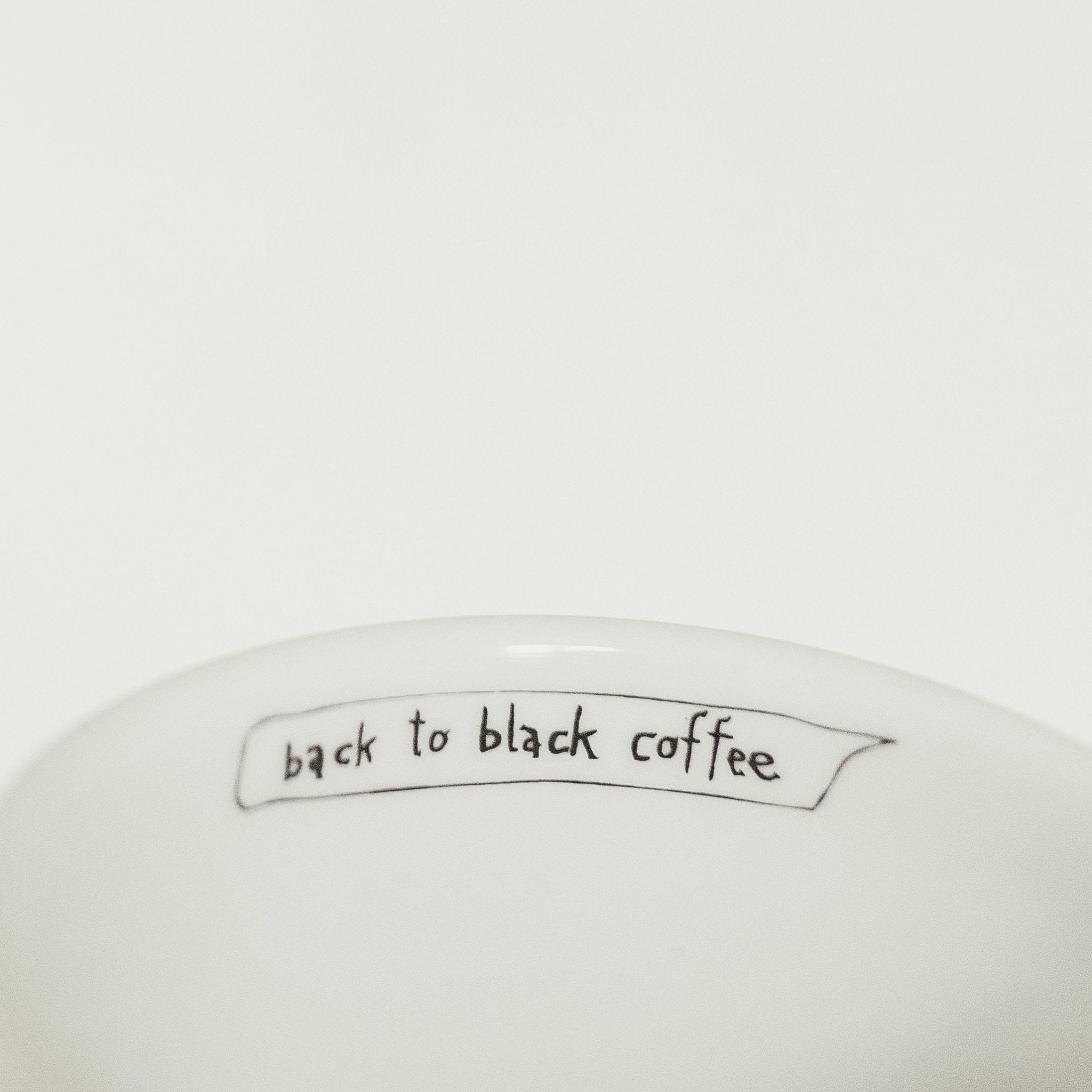 Porcelain cup inspired by Amy Winehouse text inside of the cup