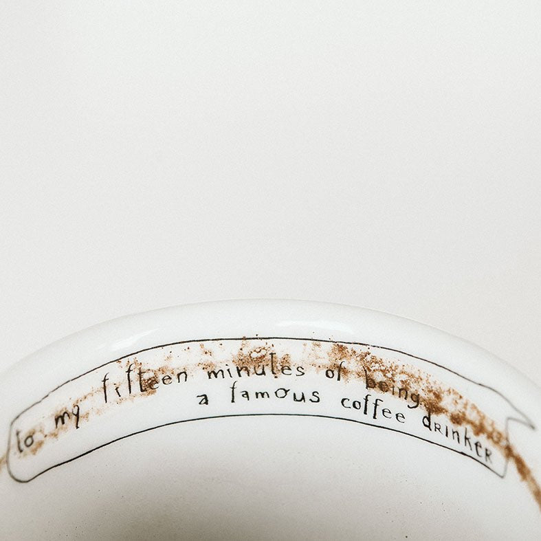 Porcelain cup inspired by Andy Warhol text inside of the box