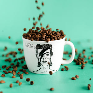Porcelain cup inspired by David Bowie with coffee beans