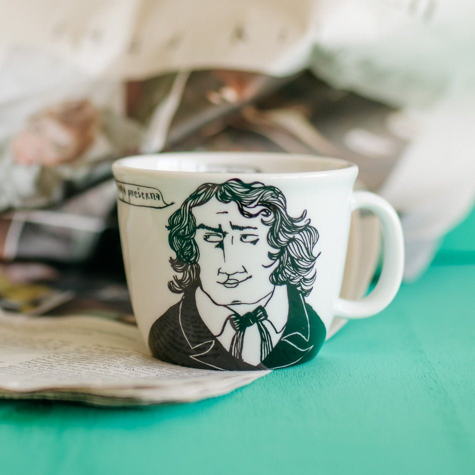 Porcelain cup inspired by France Prešeren with newspaper