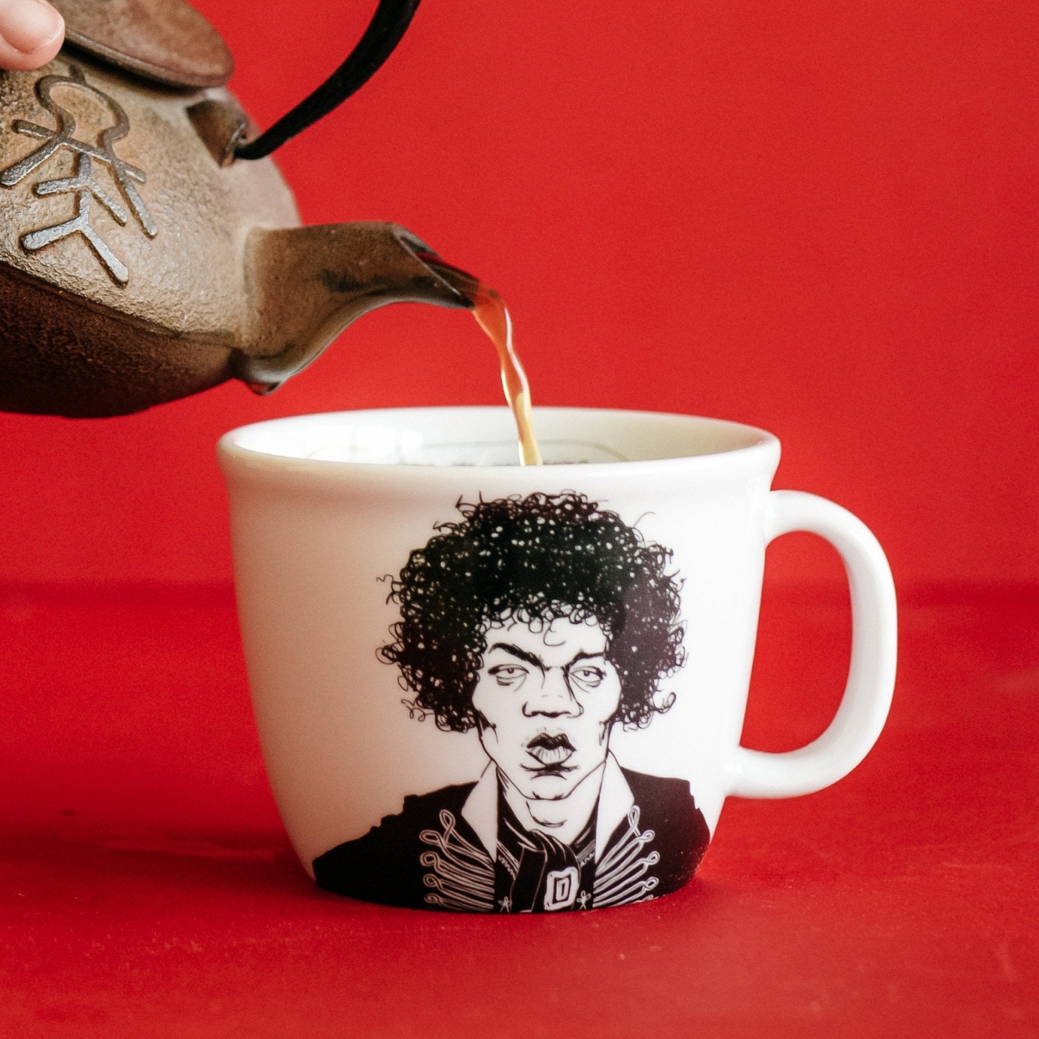 Porcelain cup inspired by Jimi Hendrix with tea
