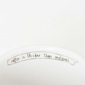 Porcelain cup inspired by Lemmy Kilmister text inside of the cup