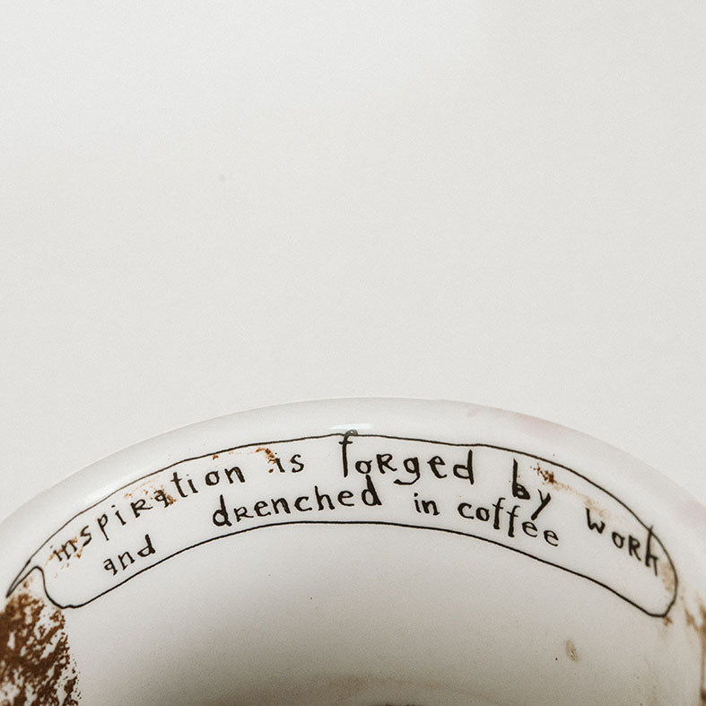 Porcelain cup inspired by Pablo Picasso text inside of the cup