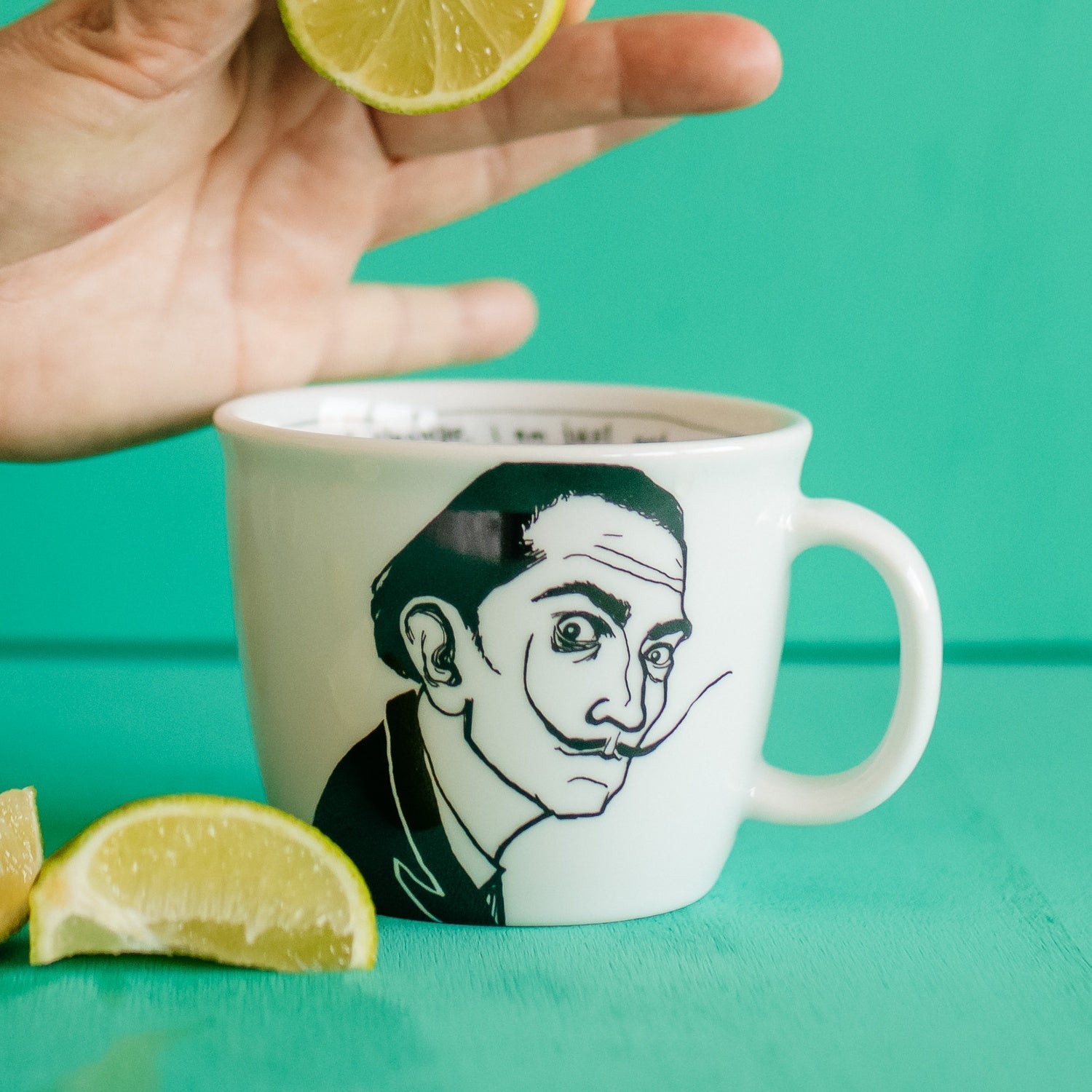Porcelain cup inspired by Salvador Dali with limes