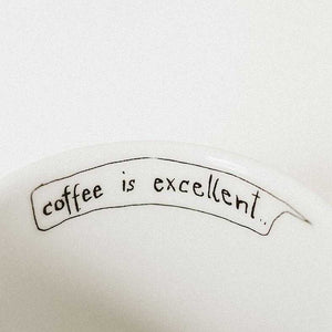 “coffee is excellent…” text on the edge of the HERCULE espresso set